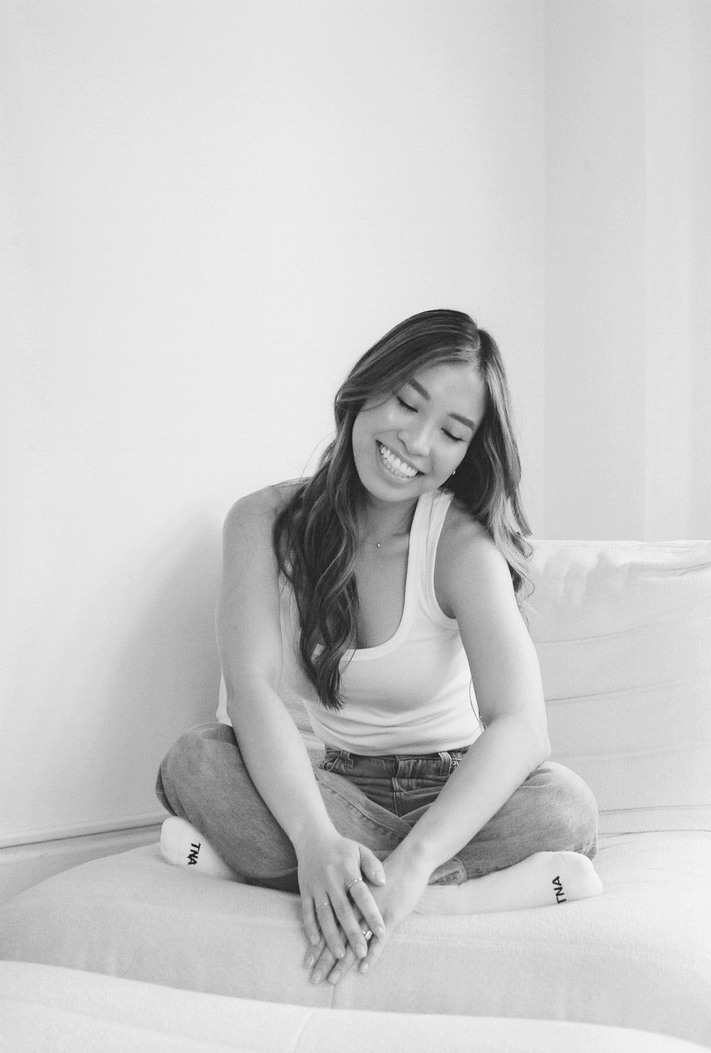 Natural black and white portraits showing comfortable poses on white background.