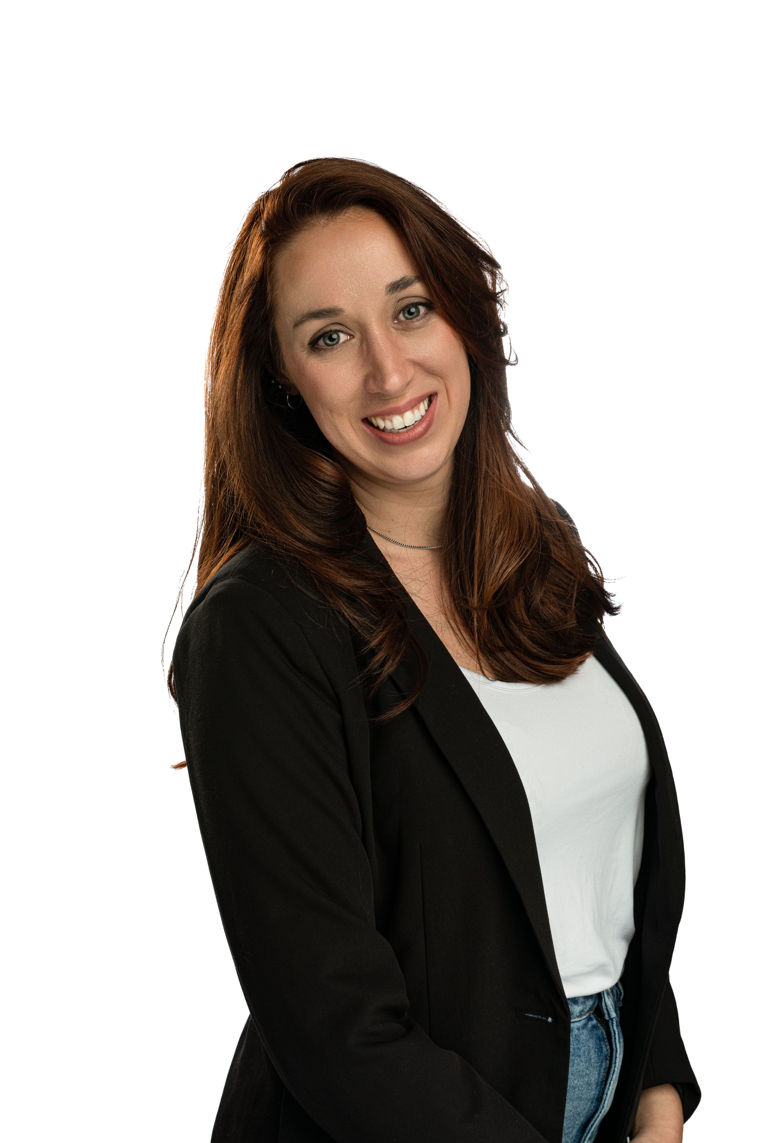 Professional headshot of person in black blazer and white top against neutral background.