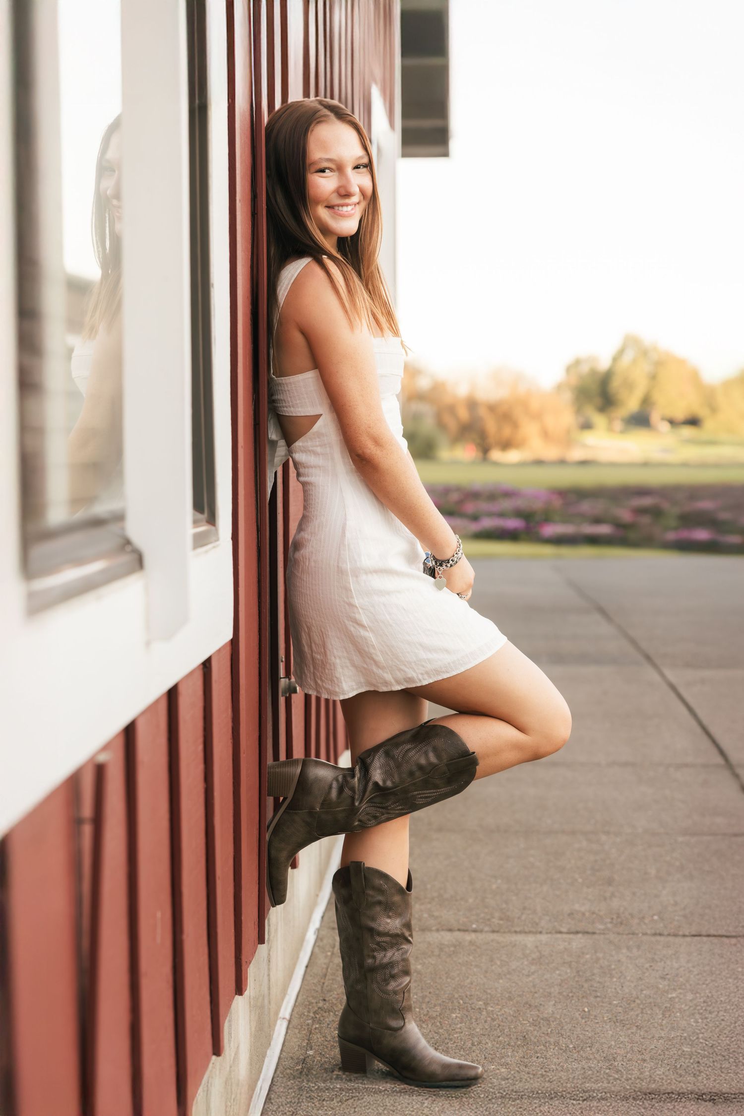 A set of lifestyle portraits with combat boots and casual wear on concrete steps with warm lighting.