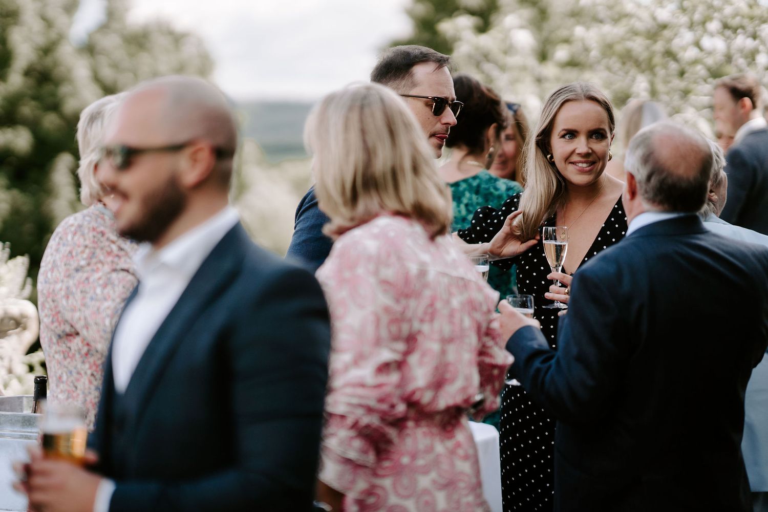 wedding guests enjoying drinks reception at wedding at hamswell house in bath