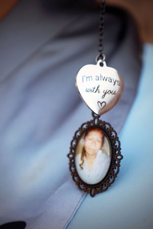 Memorial locket charm engraved with I'm always with you featuring a woman's portrait photo.