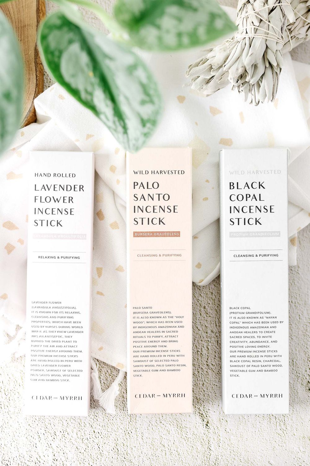 Three minimalist incense stick packages featuring lavender, palo santo, and black copal varieties.