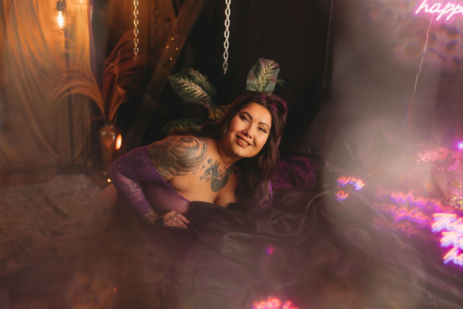 Tattooed woman in lingerie for self love boudoir session in georgetown, south carolina boudoir studio