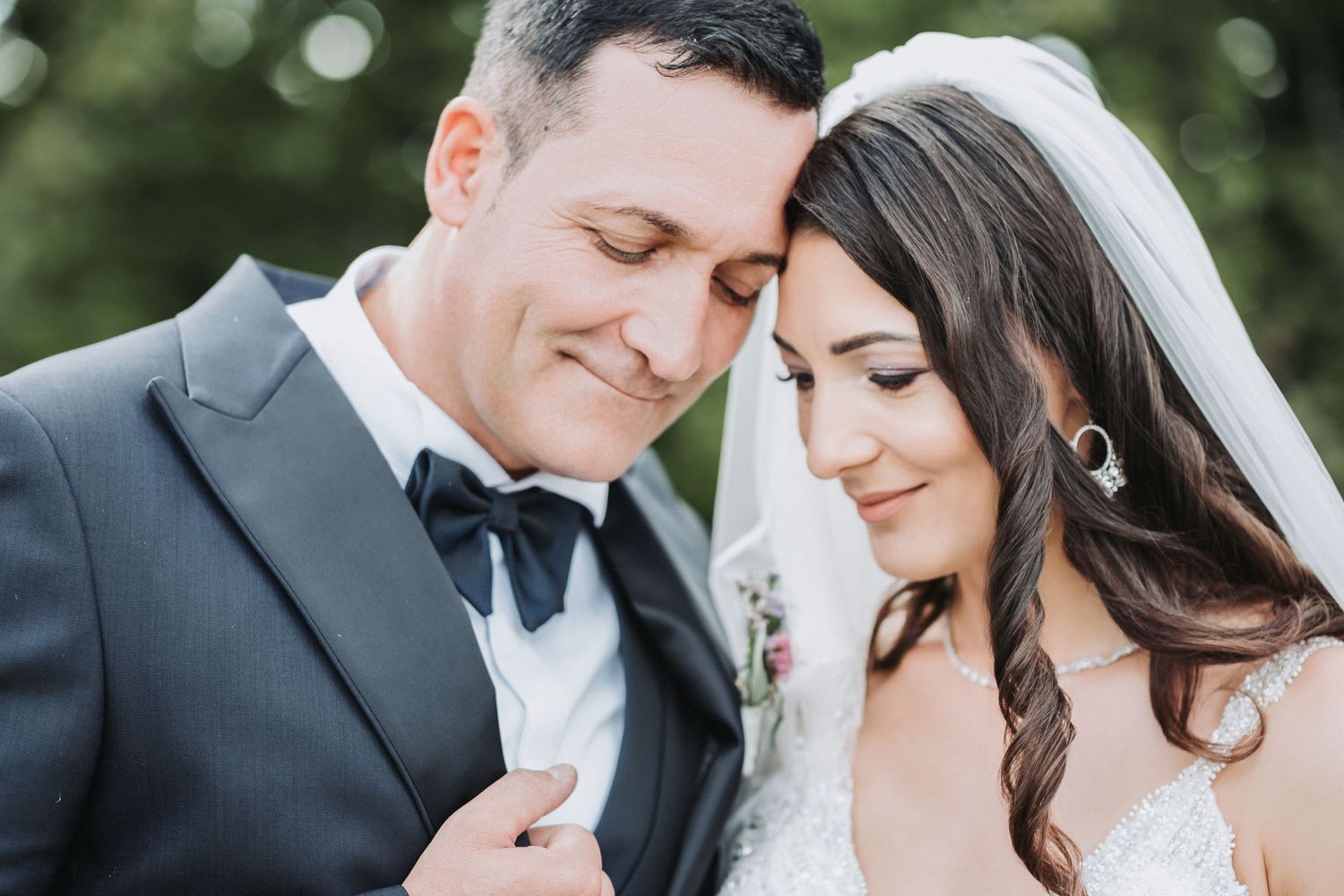 Romantic close-up of newlywed couple sharing intimate moment.