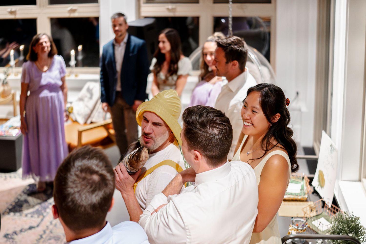 Wedding guests share a joyful moment of laughter during a Newfoundland Screech-In celebration.
