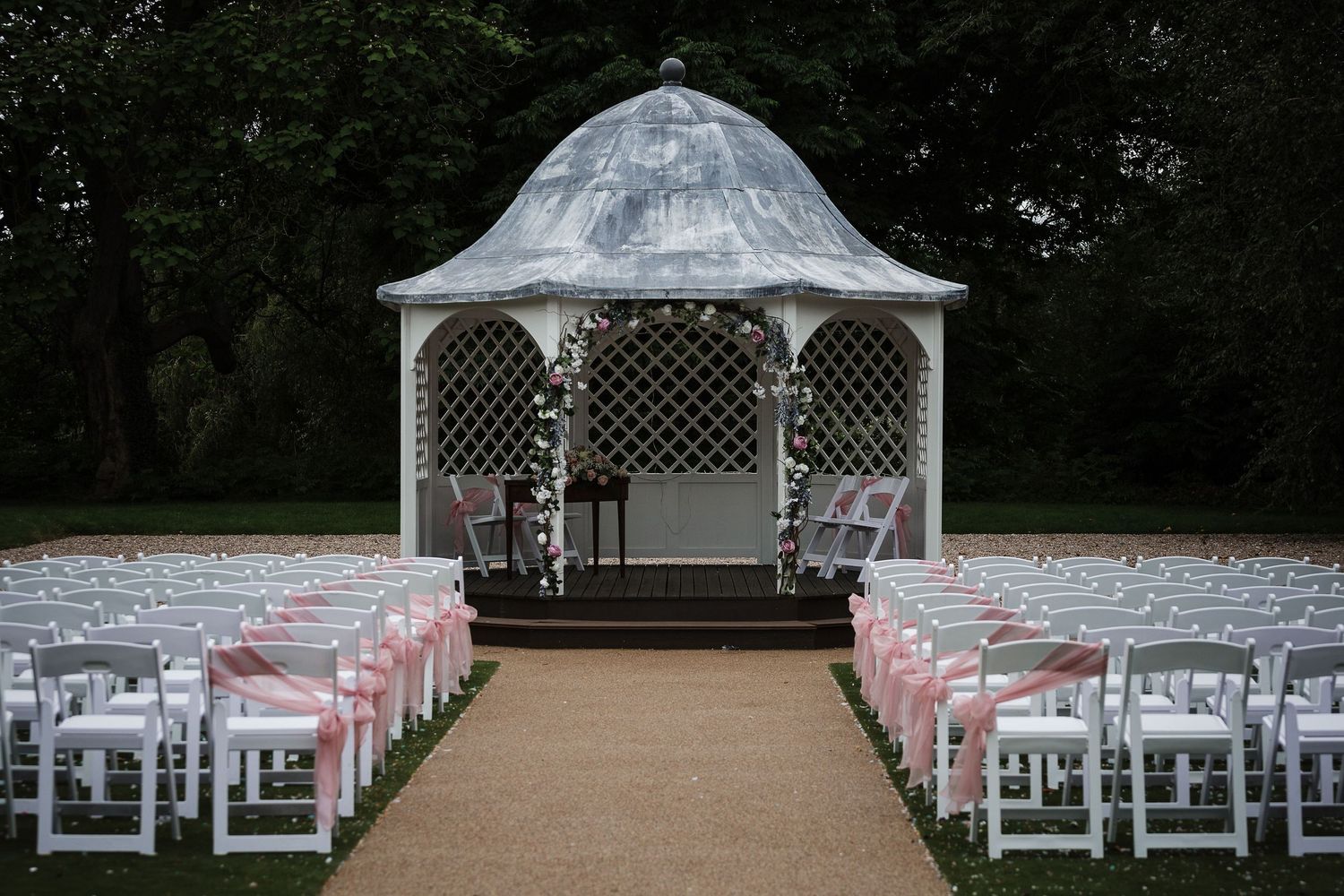 Hodsock Priory Gazebo wedding ceremony setup with chairs and soft natural light