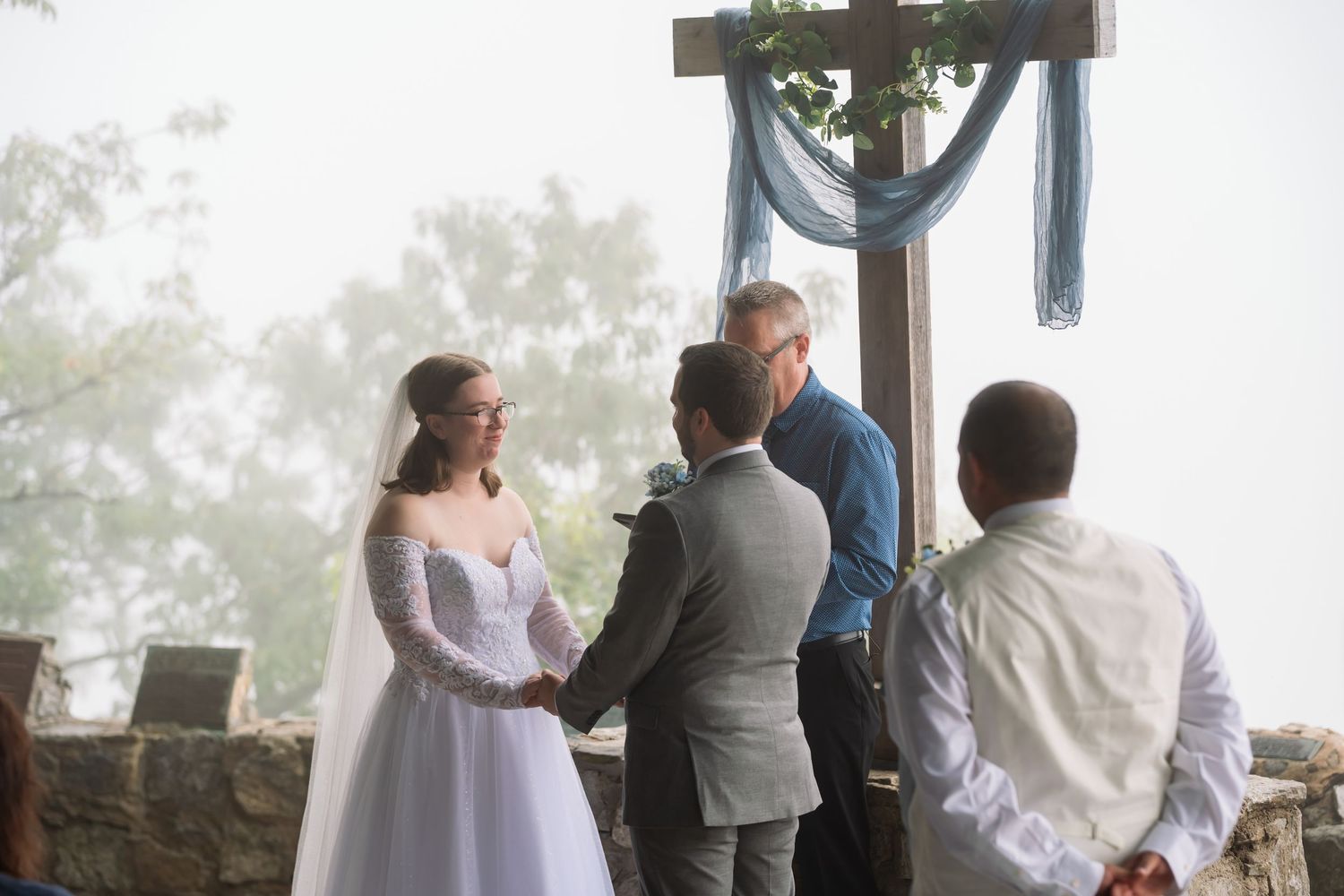 A series of wedding ceremony moments captured in an outdoor setting with a misty forest backdrop.