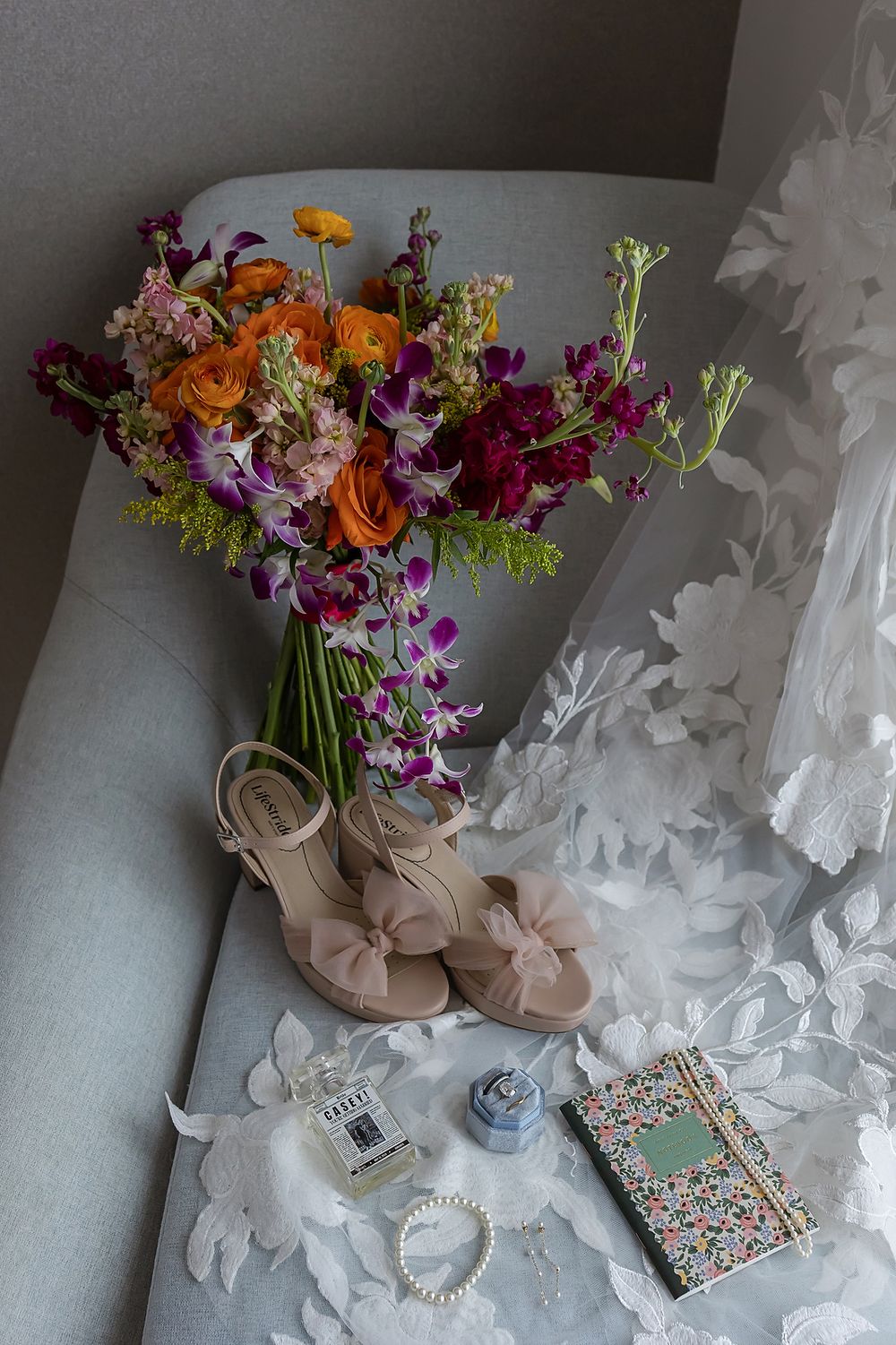Tropical bouquet, shoes, and rings styled for a Live Aqua Cancún wedding.
