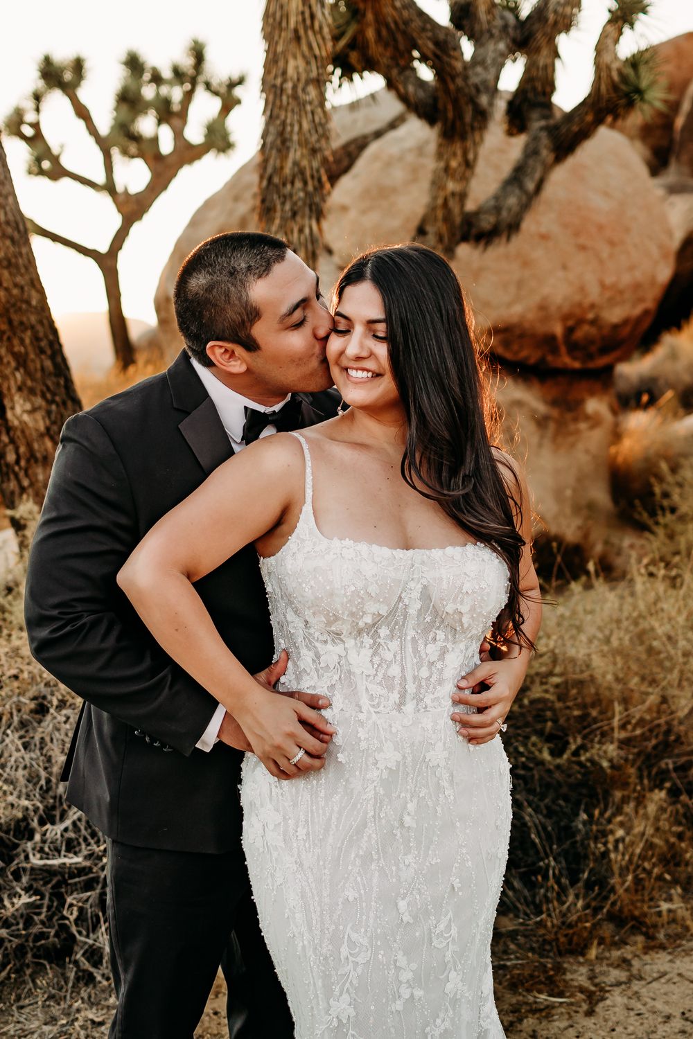 Intimate desert wedding photography with romantic natural lighting.