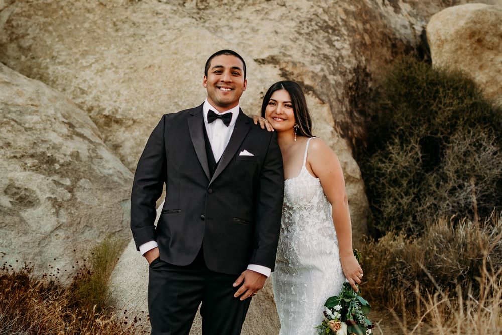 Wedding portraits featuring scenic desert backdrop and natural rock formations.