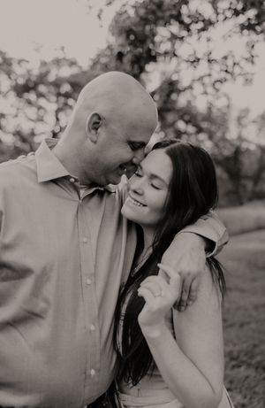 A series of intimate black and white portraits capturing tender moments between a couple.