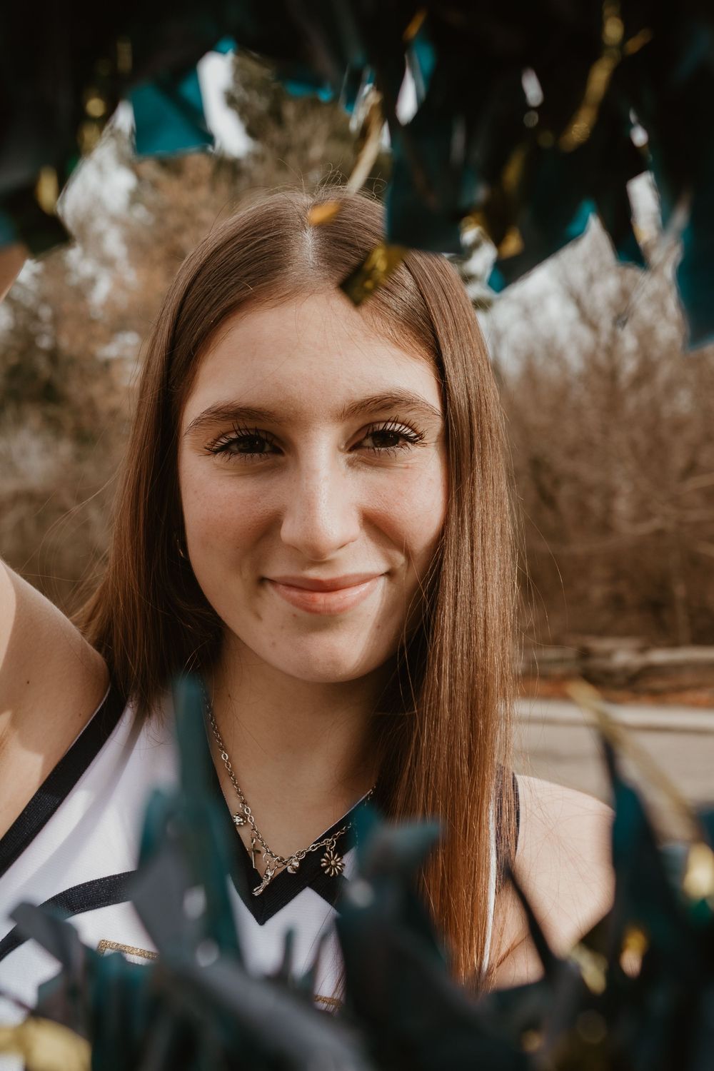 A series of close-up portrait shots showing someone with long straight brown hair and a gentle smile in natural lighting.