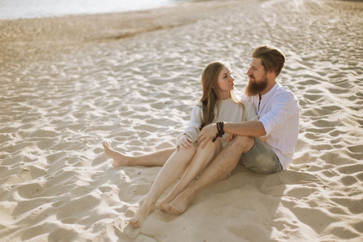 Relaxed couple enjoying a candid moment during a photoshoot