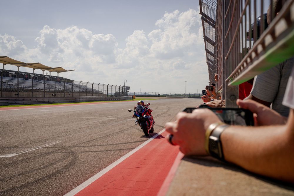 View of a racetrack wall and barriers from a low angle perspective.