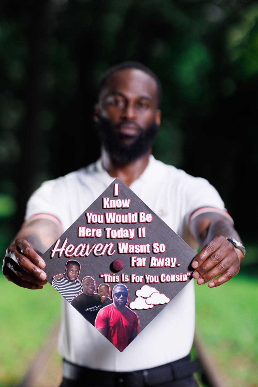 Decorative graduation caps with inspirational messages displayed in an outdoor setting.