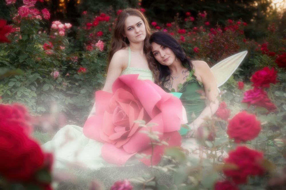 Dreamy fantasy photoshoot with a rose prop during golden hour in the Rose Garden At Manito Park in Spokane Washington.