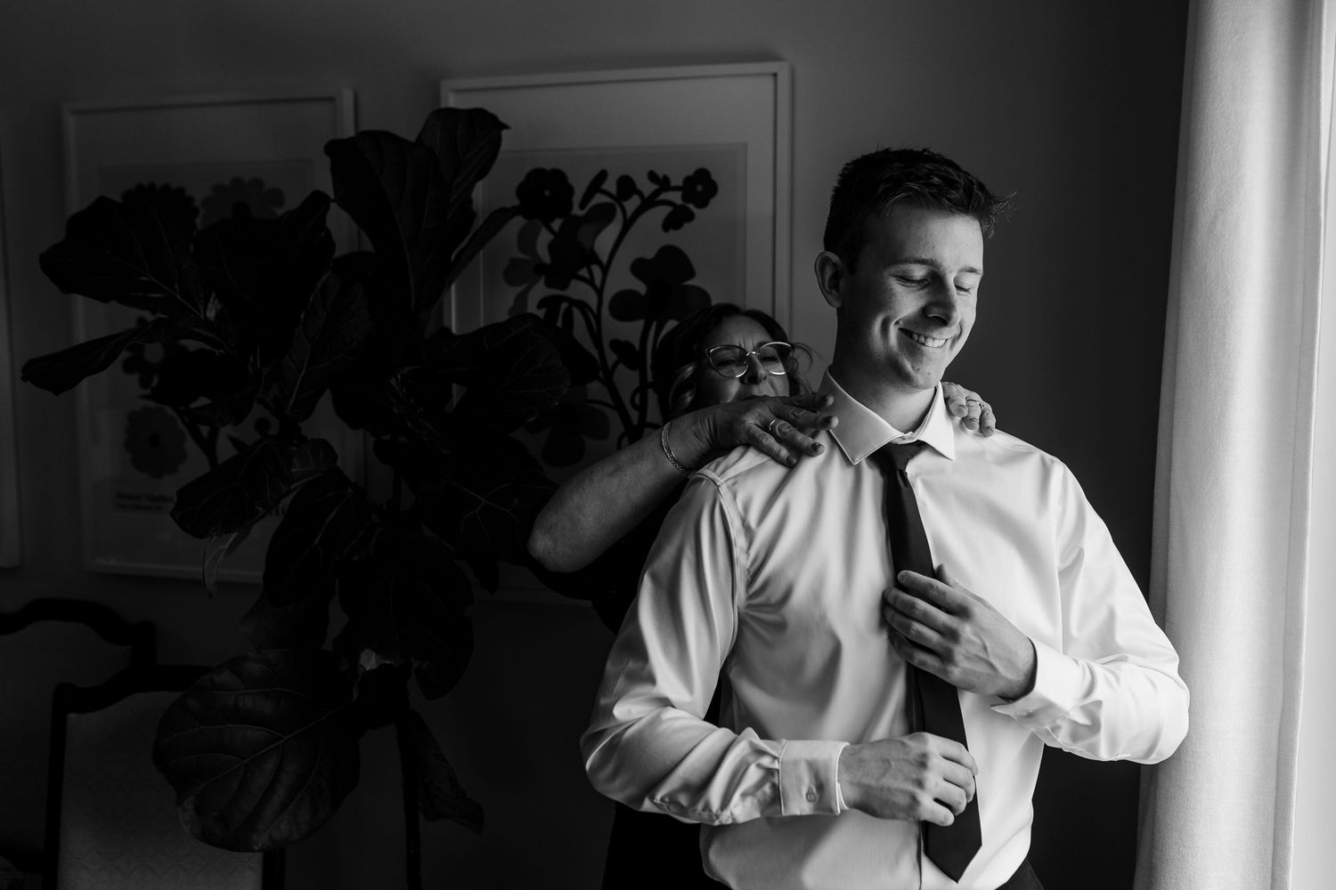 A series of black and white emotional moments captured during a wedding preparation.