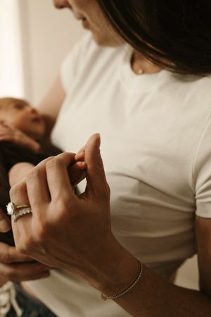 Mom and a baby girl during a lifestyle newborn session in Mount Prospect
