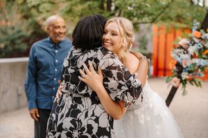 A series of wedding photos showing candid moments between couples in a garden setting with floral decorations.