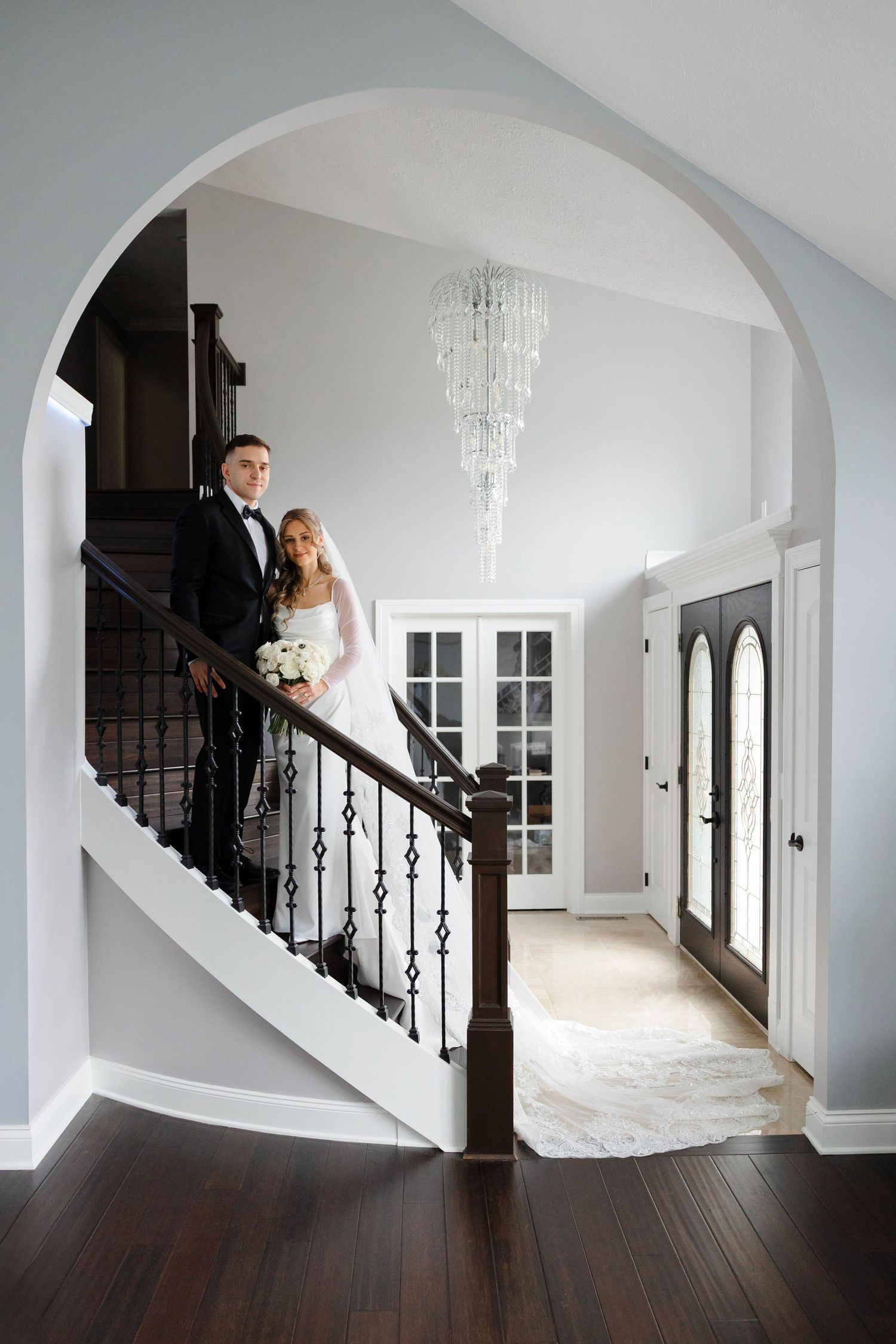 Bride and groom portrait on staircase photographed by Tom Forrest from Hudson, Ohio.