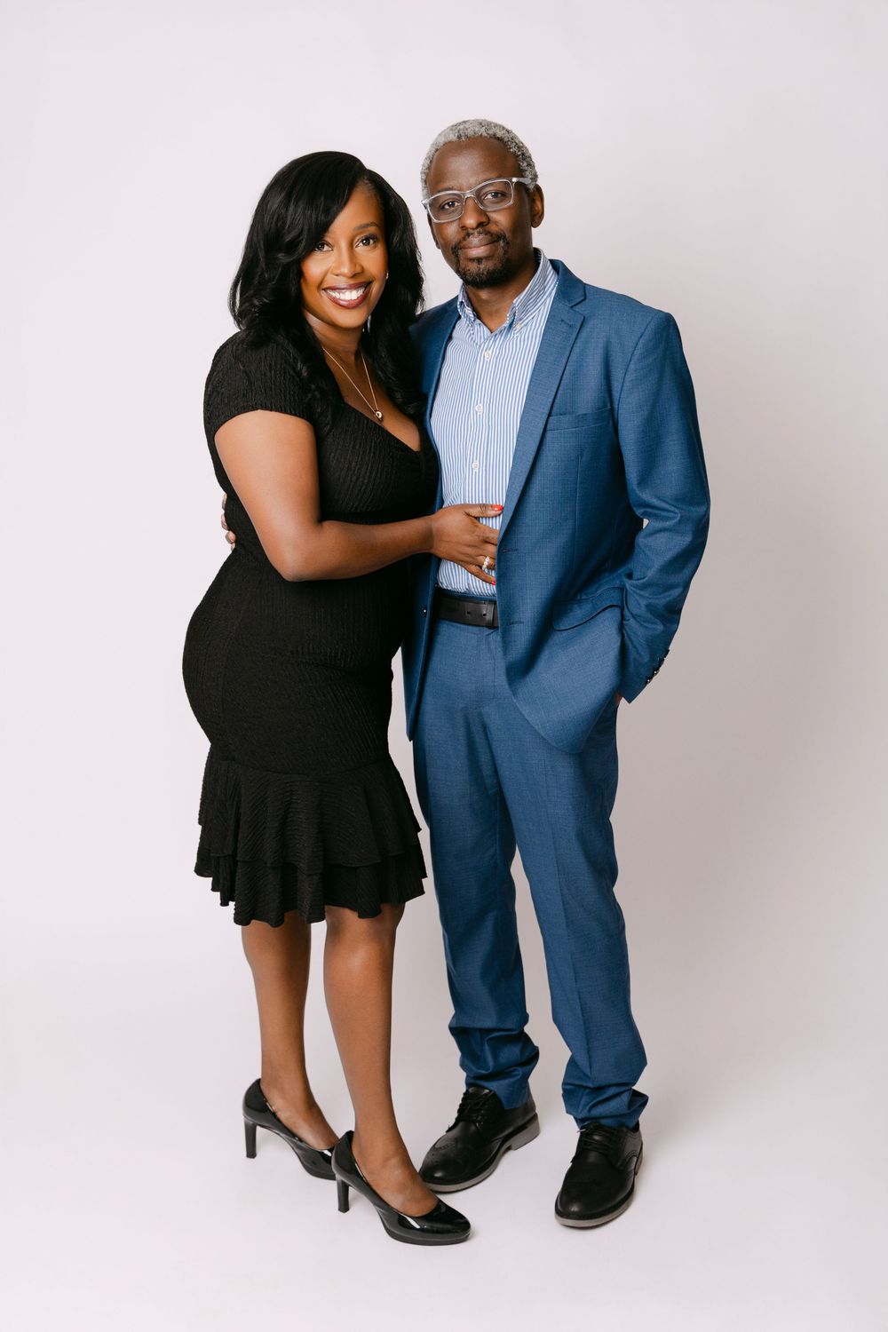 Professional studio portraits of a couple against white backdrop. Photographed by Kirsten Graham in Perth