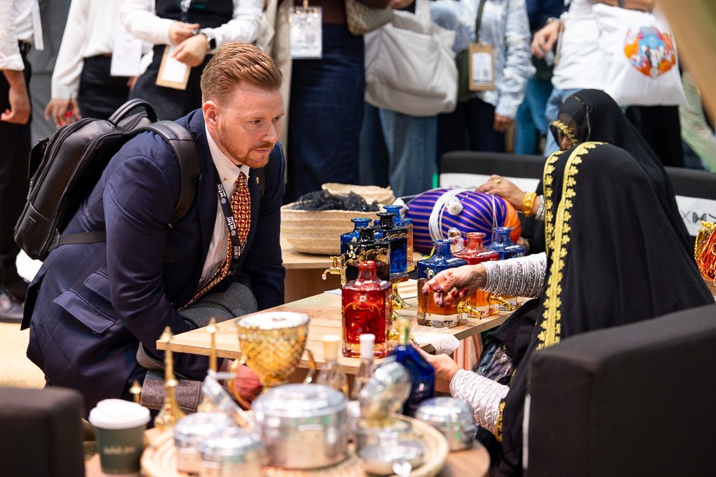 A male interacts with an exhibitor at the 2025 WTM in London.