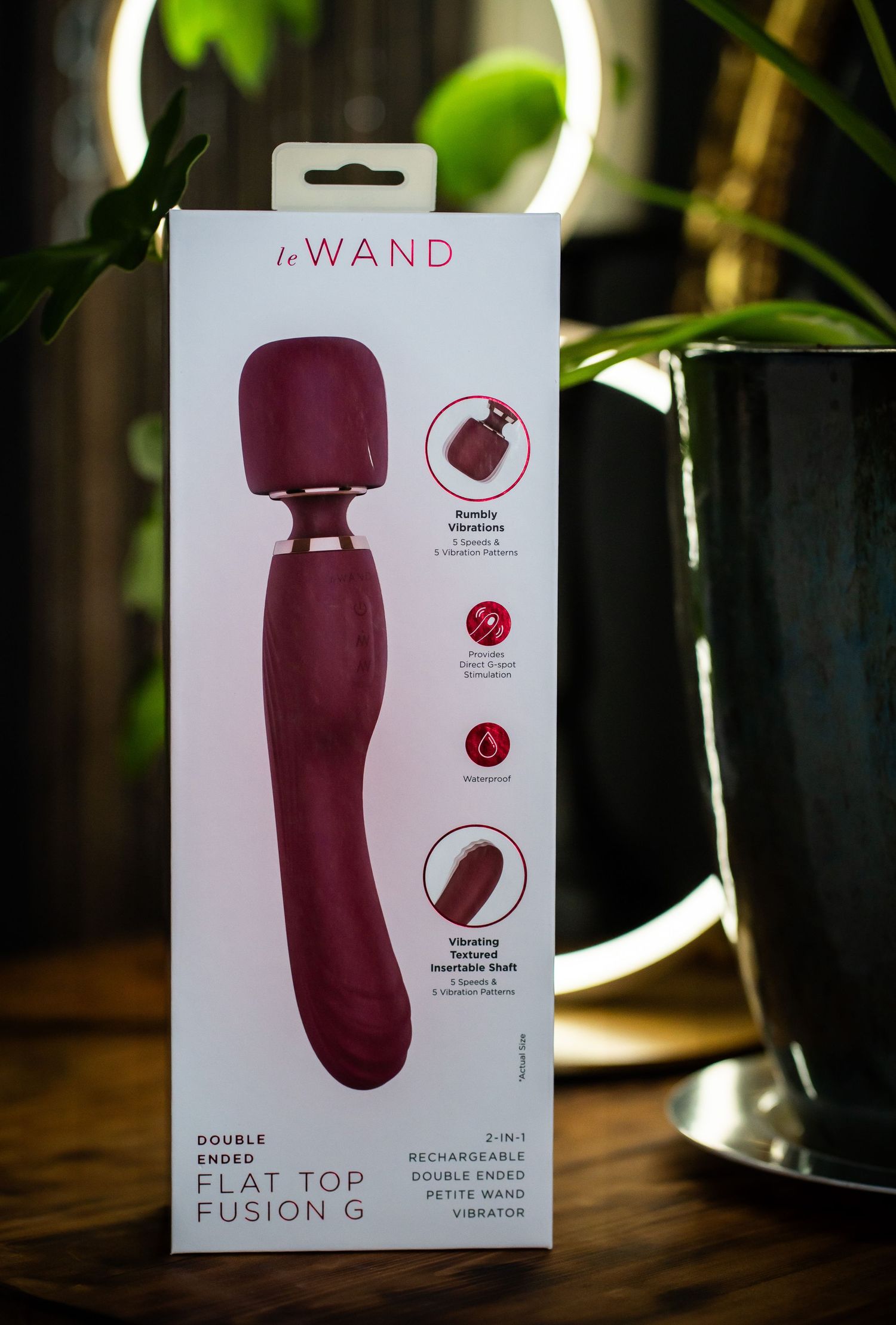 Burgundy personal massager product packaging showing features and specifications.