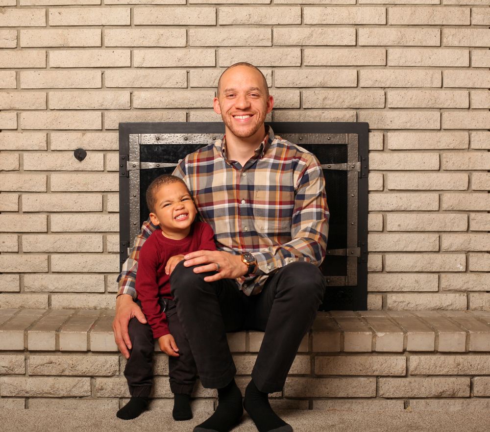 A series of four progressive photos showing playful interaction on a brick wall background.