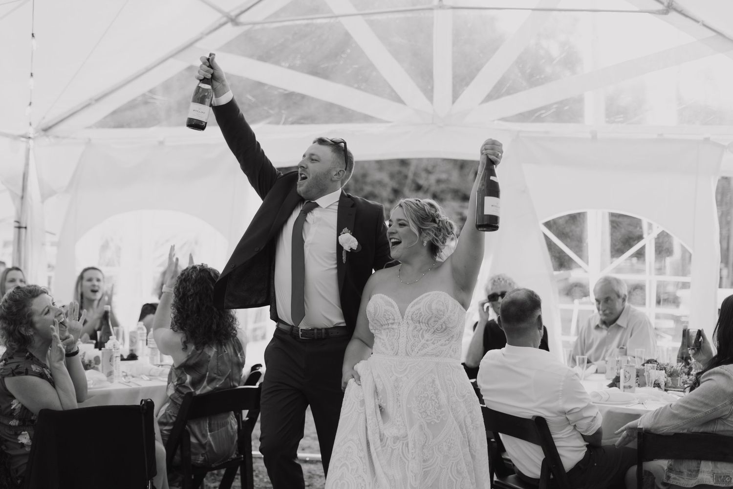 Black and white photo collage showing joyful wedding reception moments with dancing and celebration under a tent.