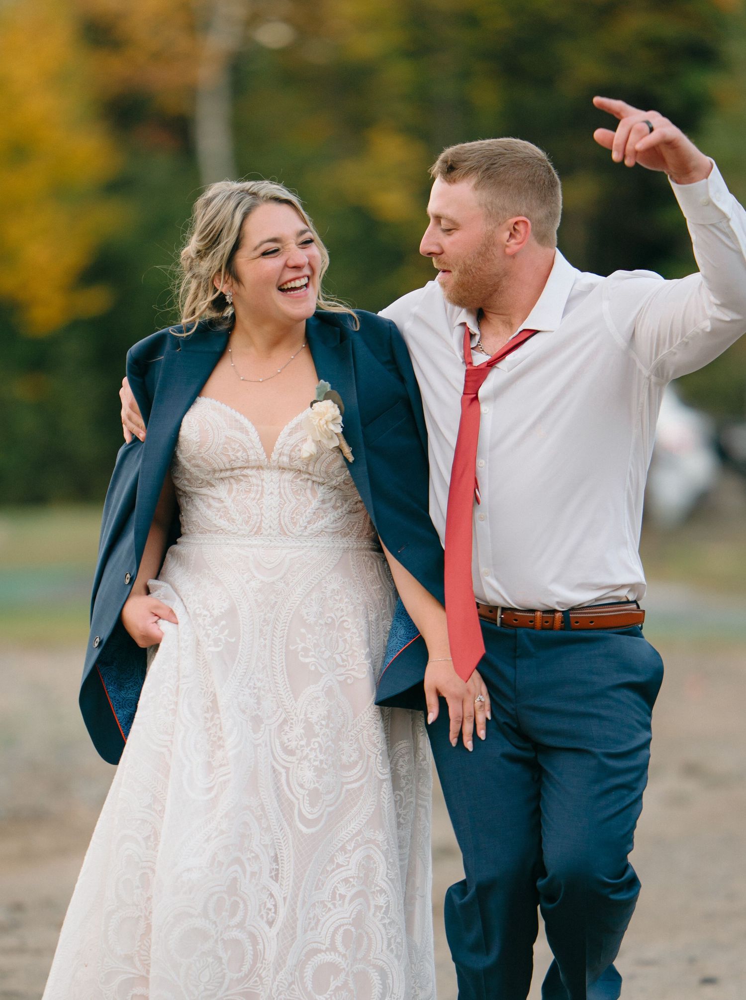 Candid shots of newlyweds laughing and dancing together outdoors.