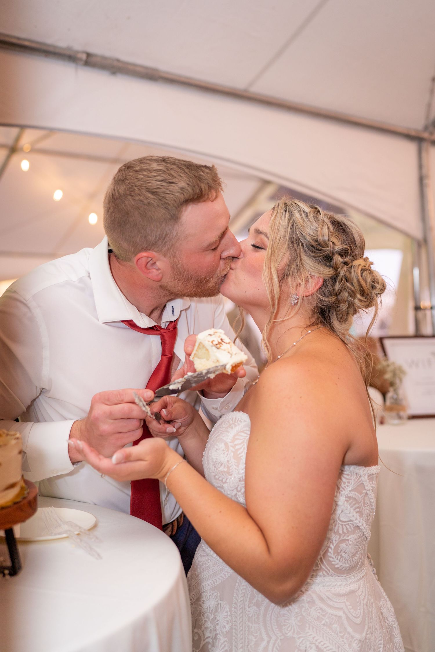 A couple shares their first bite of wedding cake together in a sequence of candid reception photos.