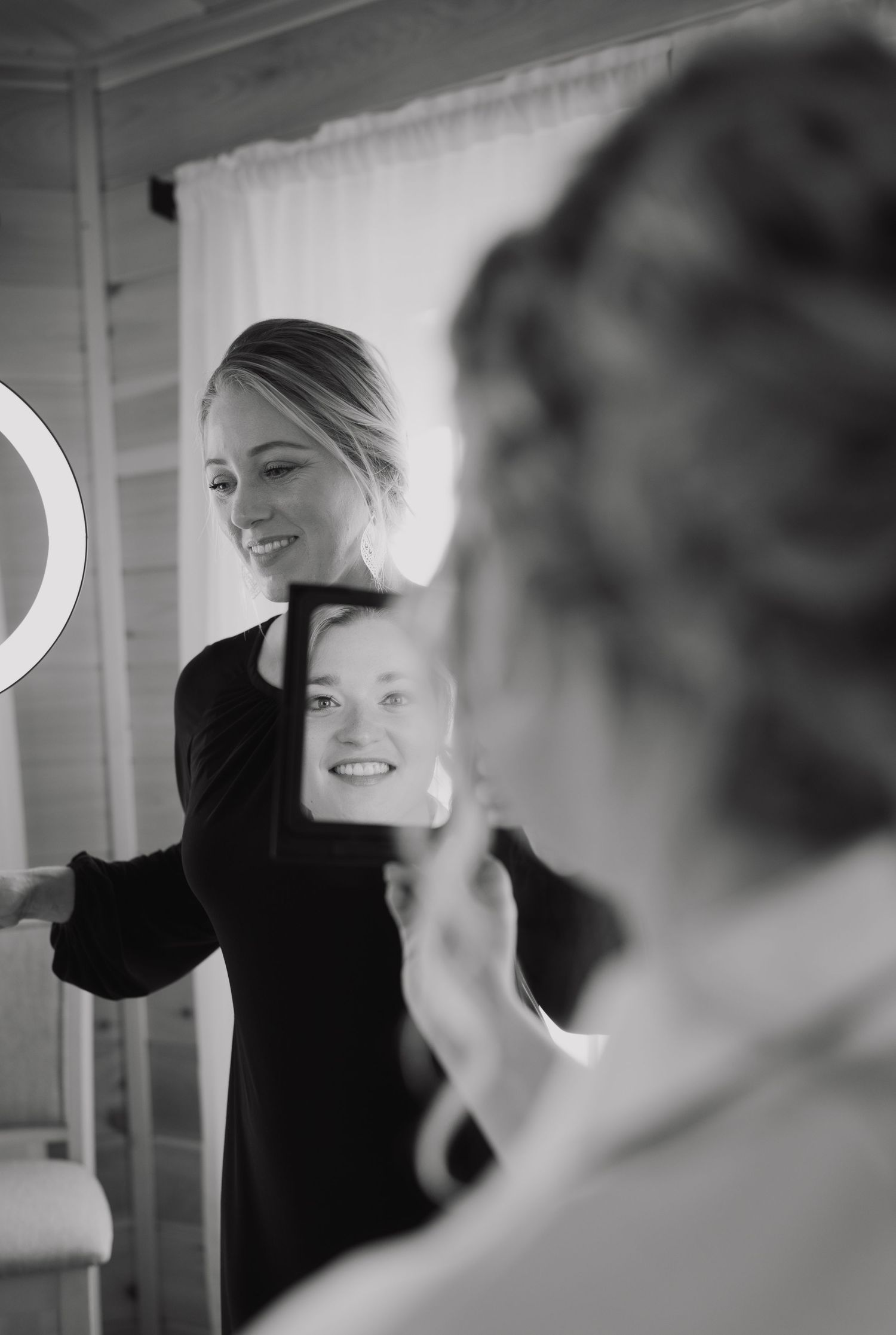 Black and white candid shots of wedding preparation moments.