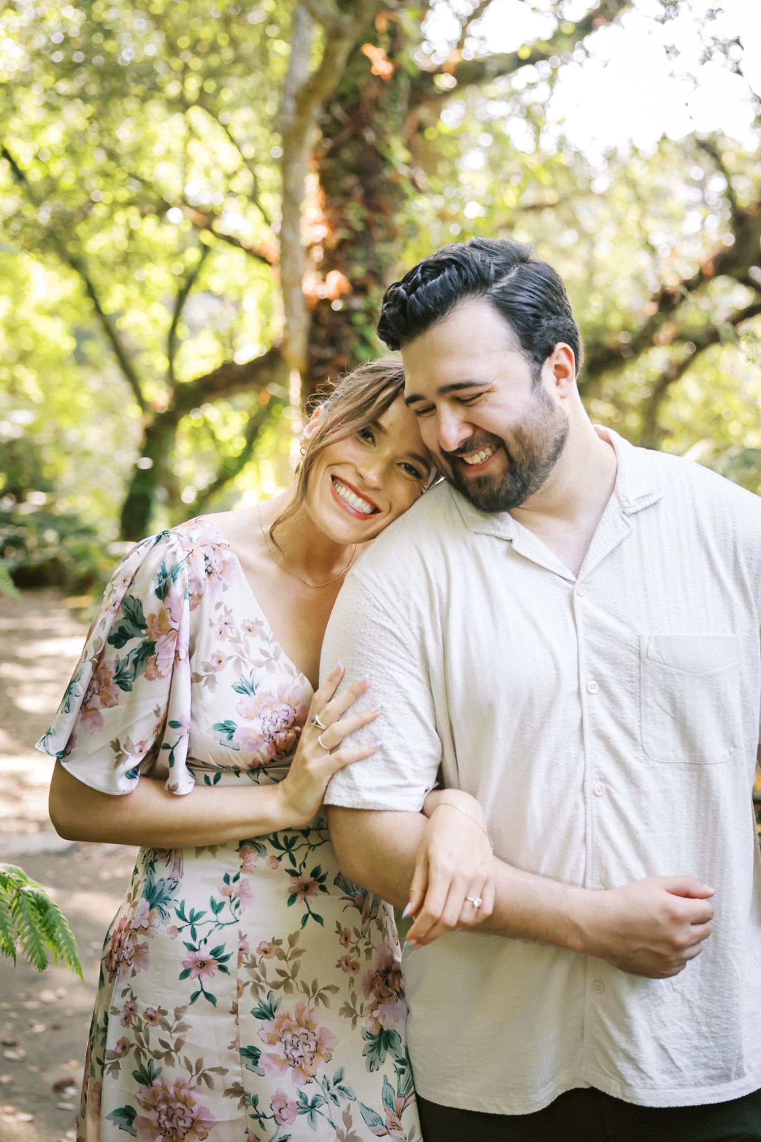 Couple walking through Mediterranean gardens in Sintra engagement session