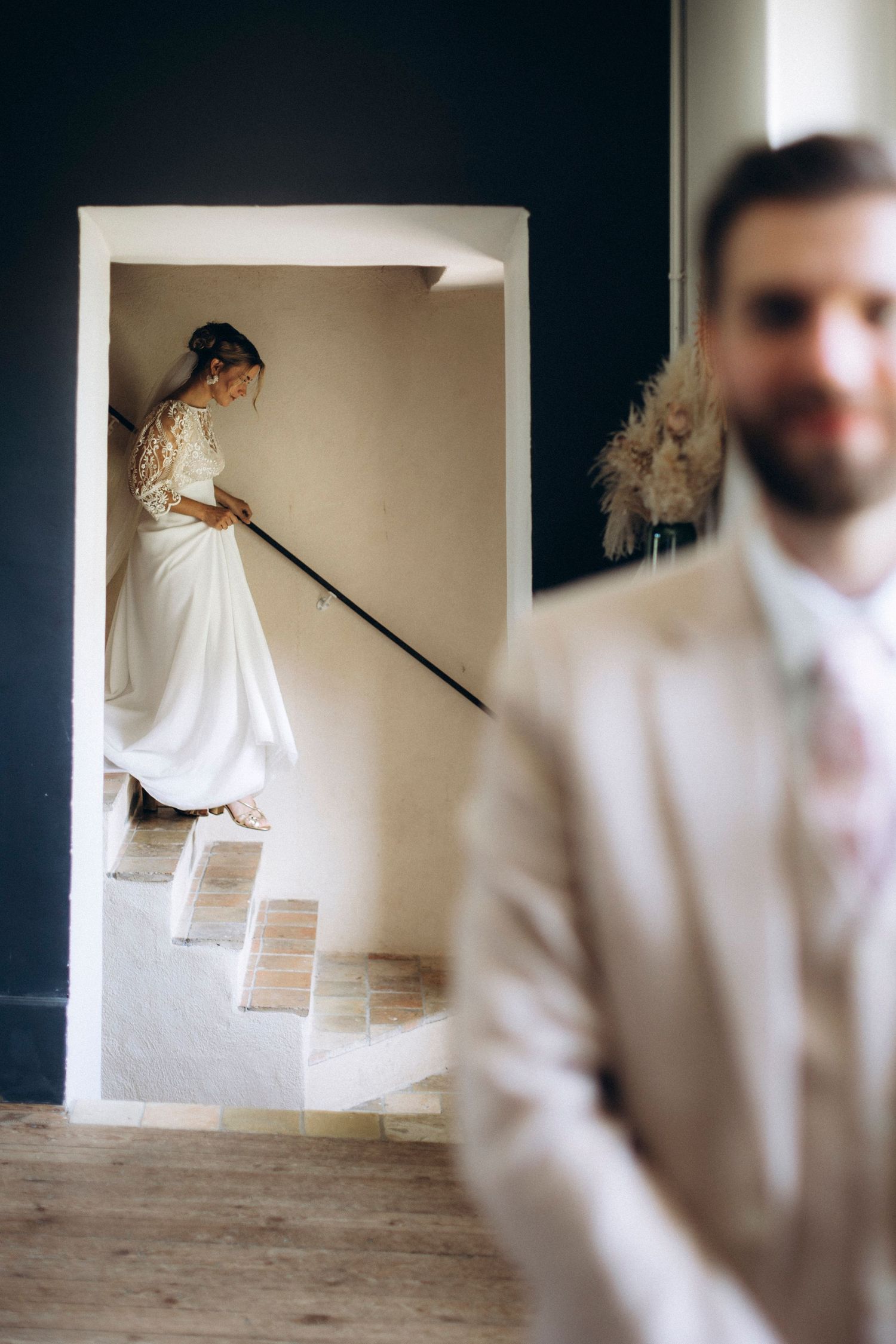 A series of motion photos showing a person in white clothing sweeping or cleaning a bare concrete floor.