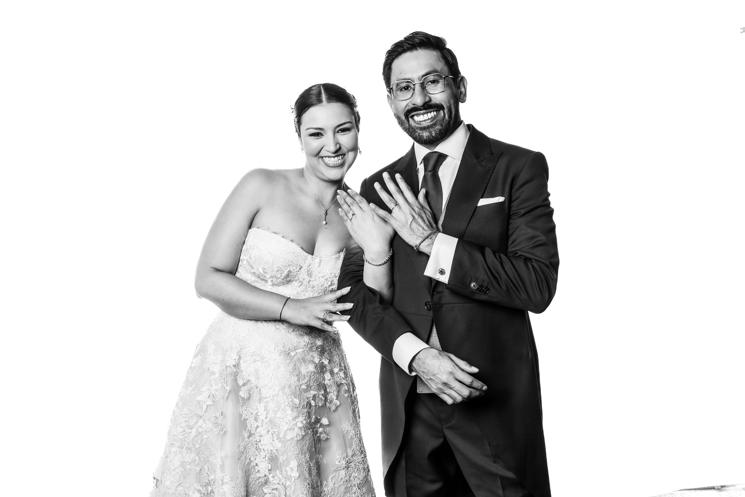 Black and white portrait of wedding party members posing together.