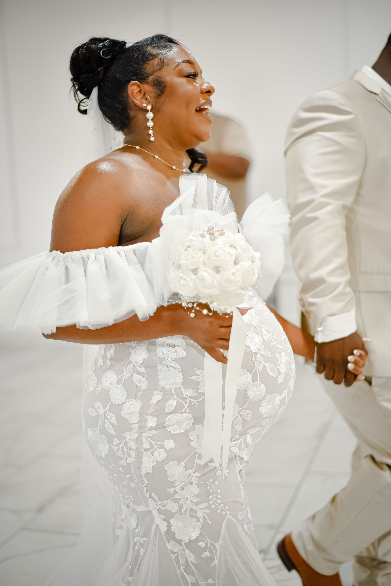 A series of intimate wedding photos showing tender moments between newlyweds in white attire against a light background.