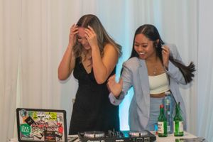 Party guests enjoying themselves at an indoor celebration event.