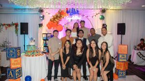 Graduation celebration with decorative lights and party decorations in an indoor venue.