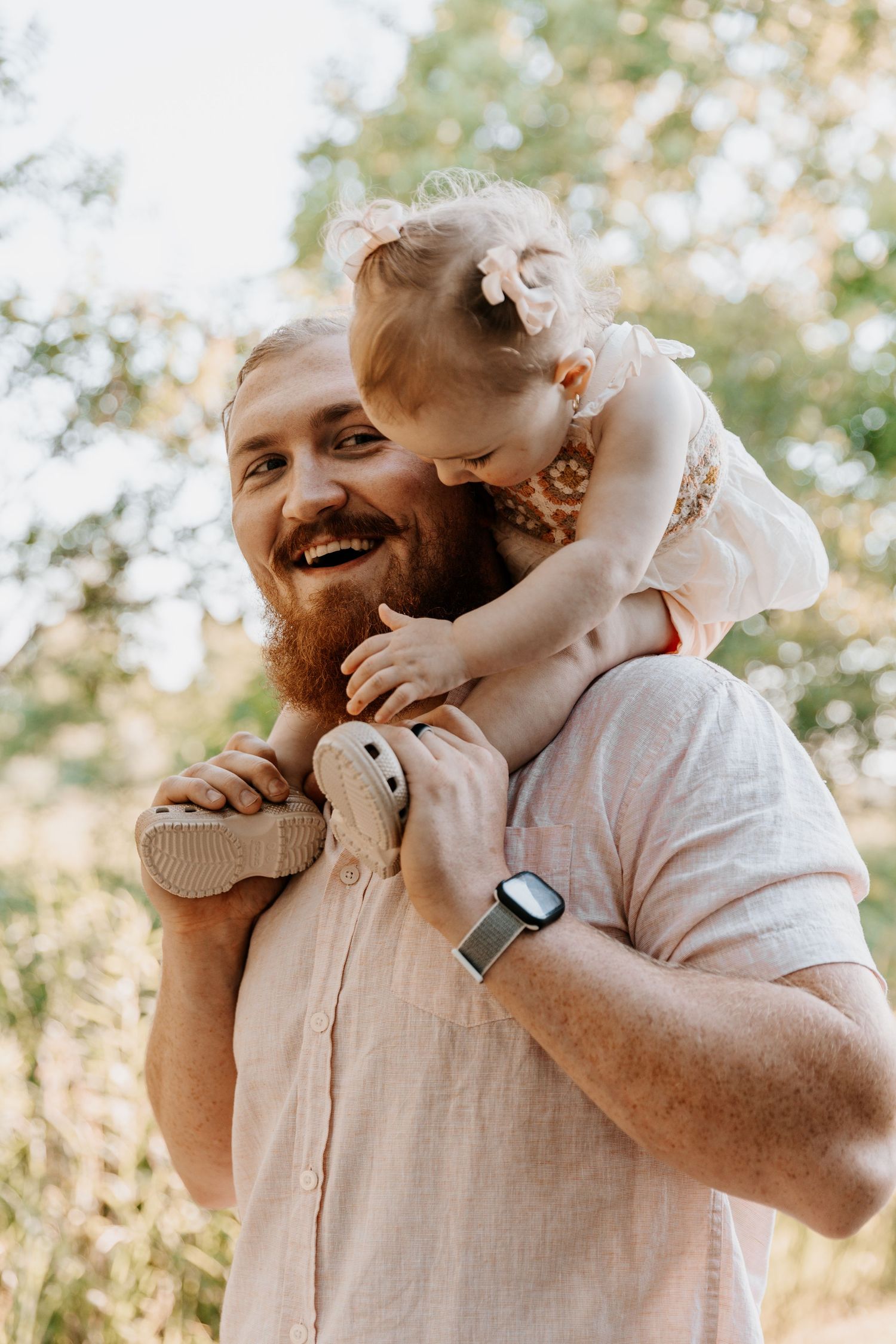 Tender parent-child moments captured in a series of candid outdoor photos.