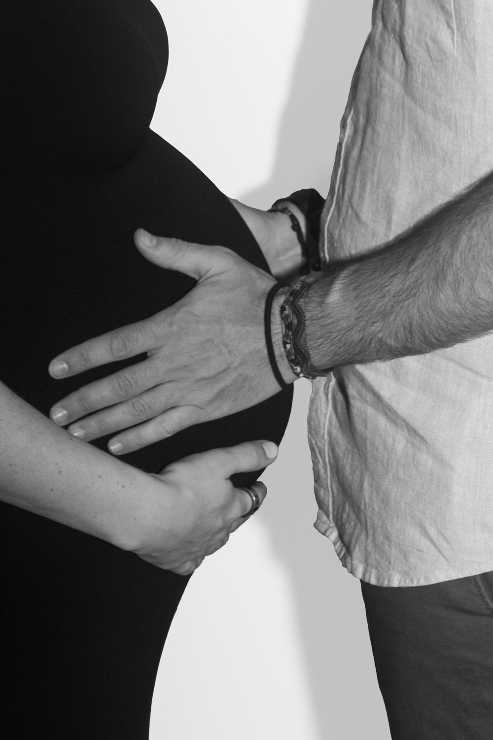 Black and white image of hands being brought together in a complementary sequence of connecting movements.