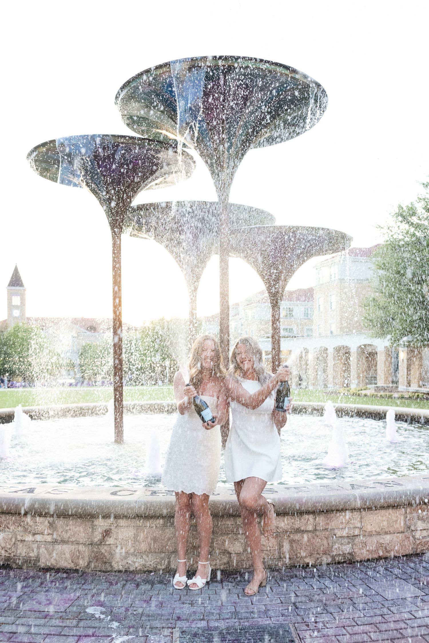 Senior photographer taking group senior photos at Texas Christian University in Fort Worth Texas.
