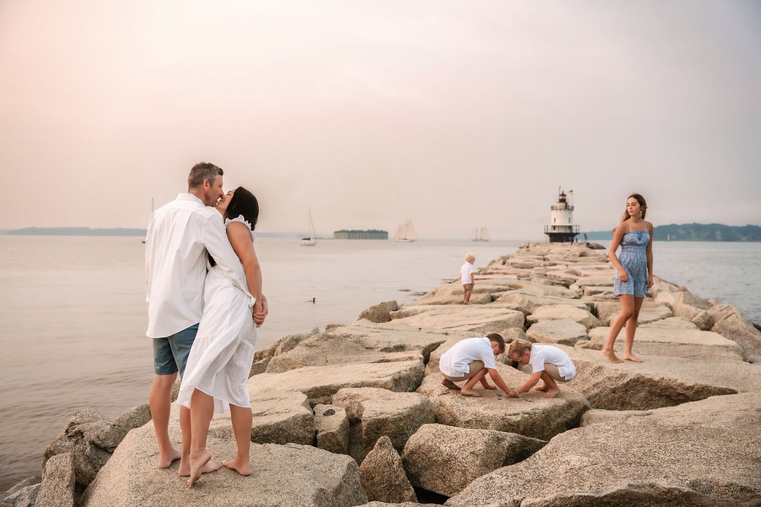 Family photograph by a lighthouse in Southern Maine