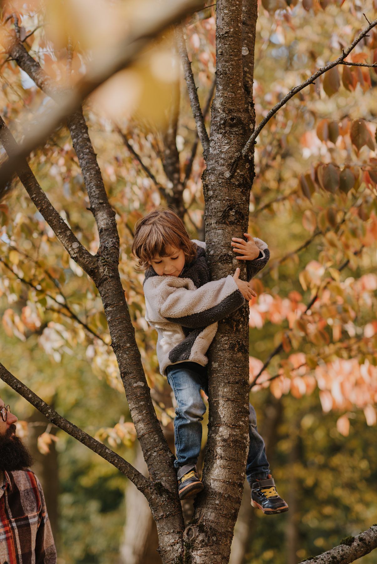 Climbing trees and exploring nature during a crisp autumn day.