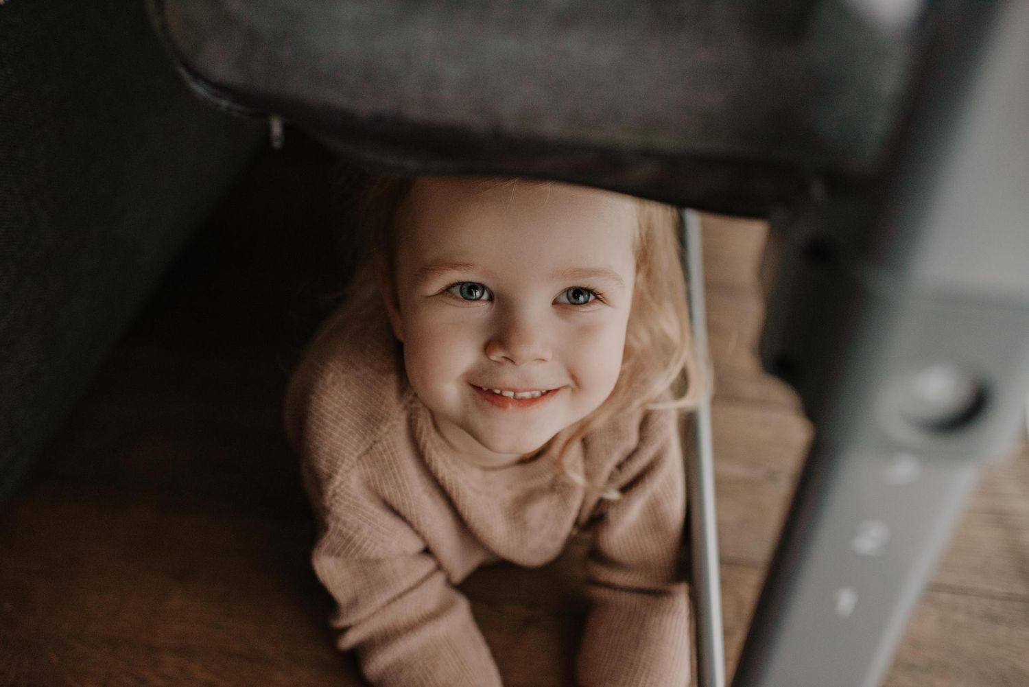 Cozy indoor lifestyle photography capturing genuine family moments.