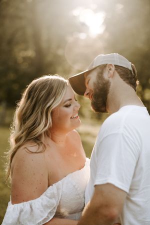 Intimate portrait series of a couple embracing in dreamy golden hour lighting.