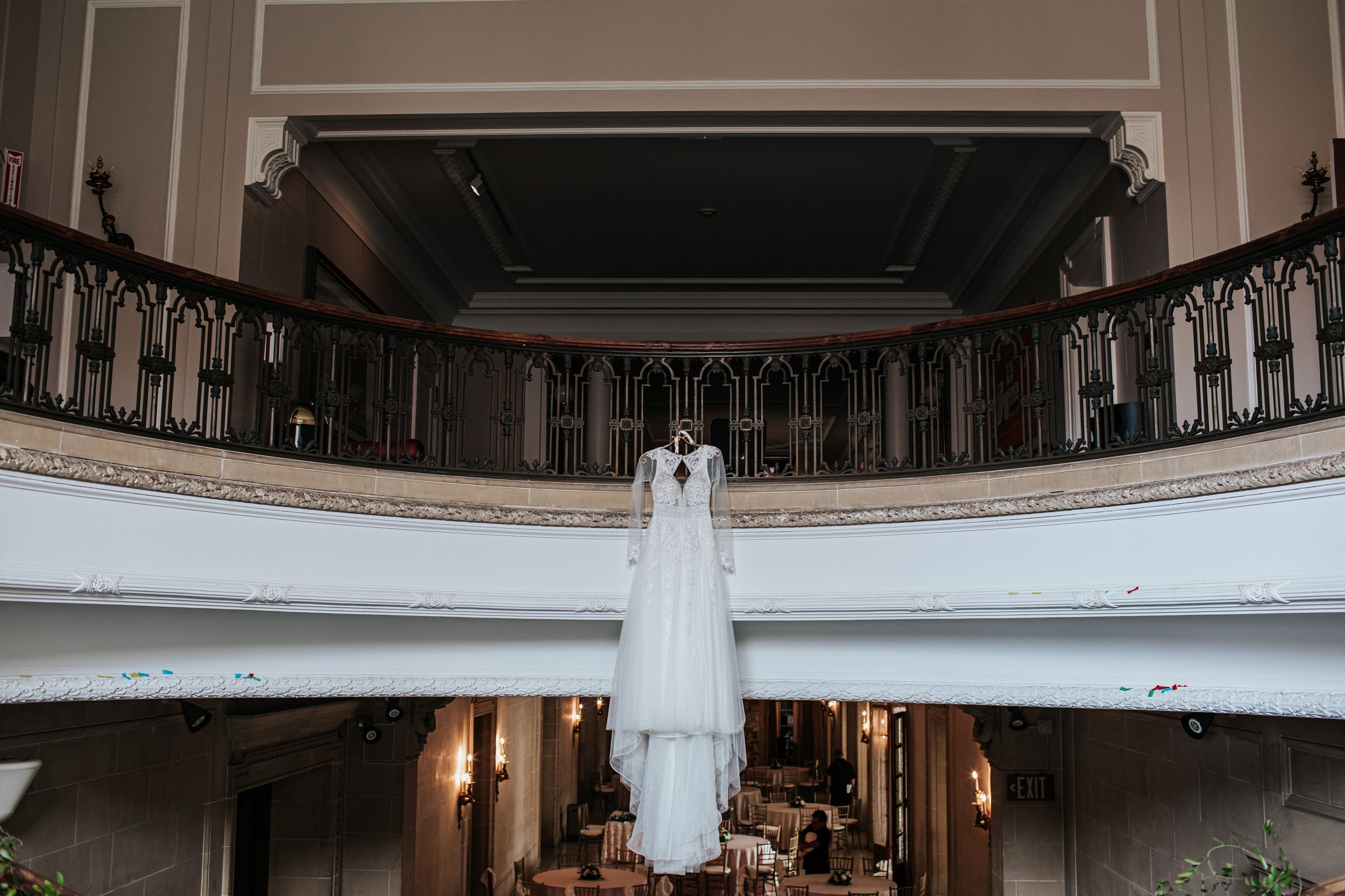 A series of six photos showing a white wedding dress displayed in an elegant church interior with balconies and arches.