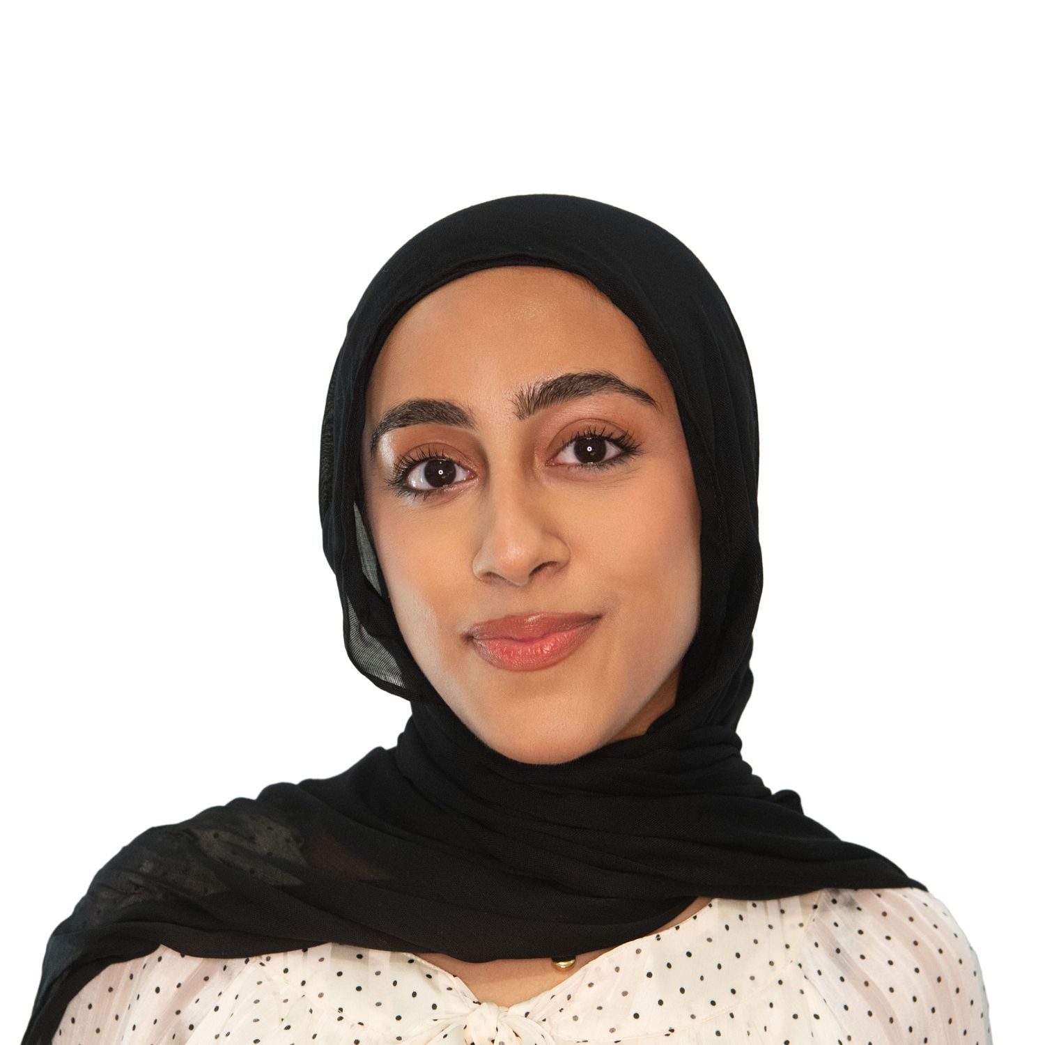 Woman in black hijab and polka dot top poses for a headshot with Leah Ramuglia Photography in Boston, MA.