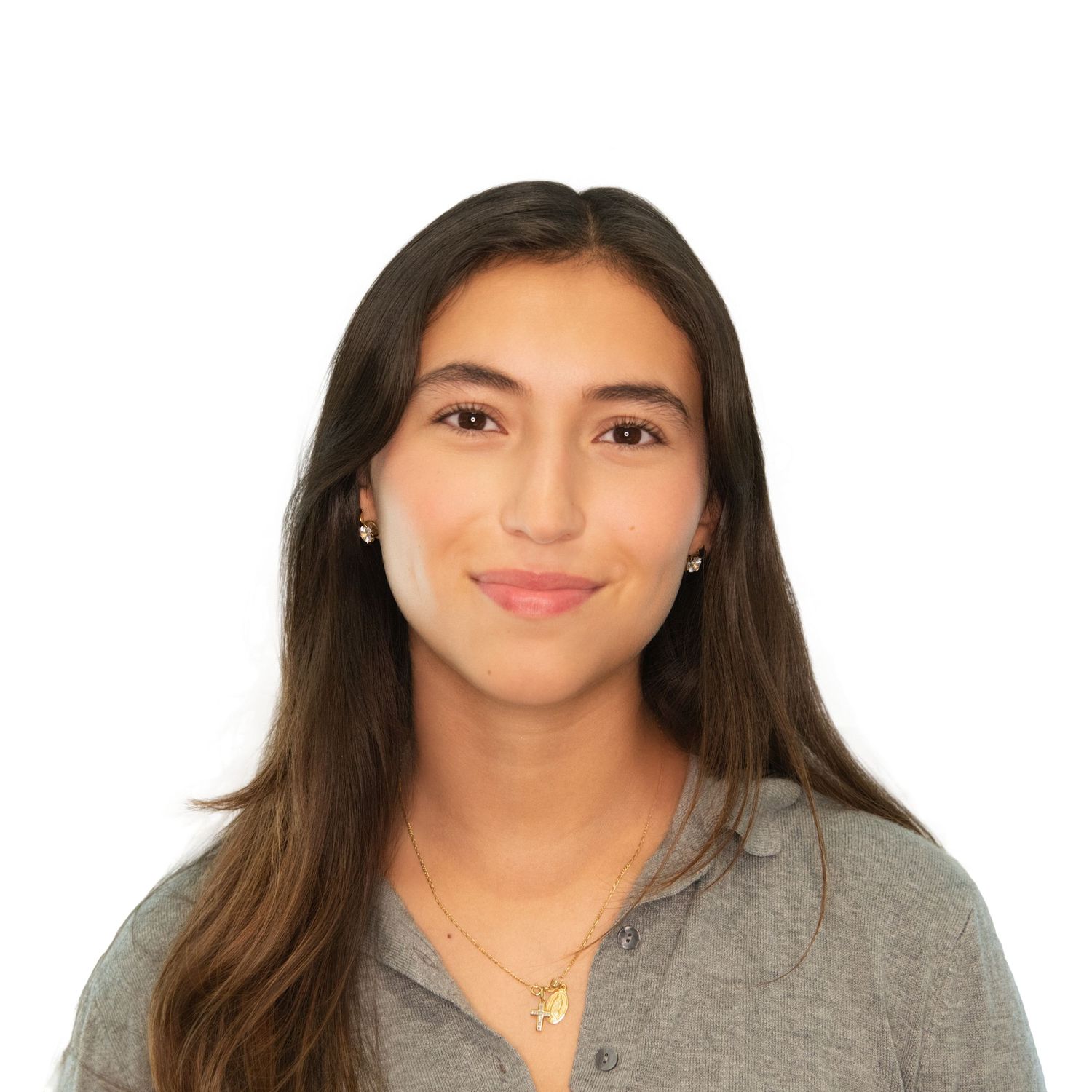 A person wearing a gray sweater smiles warmly at the camera in a professional headshot style photo. Professional women’s headshots in Boston