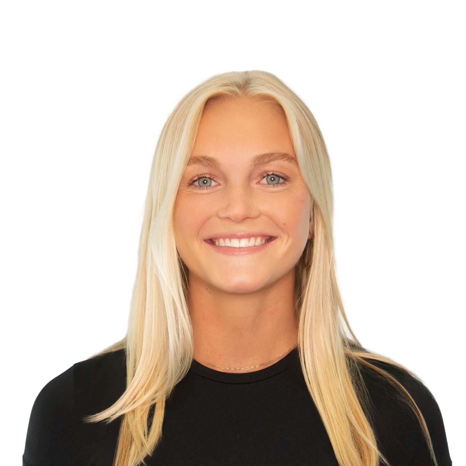 Professional headshot of a woman with long blonde hair wearing a black top against a white background photographed by Leah Ramuglia.