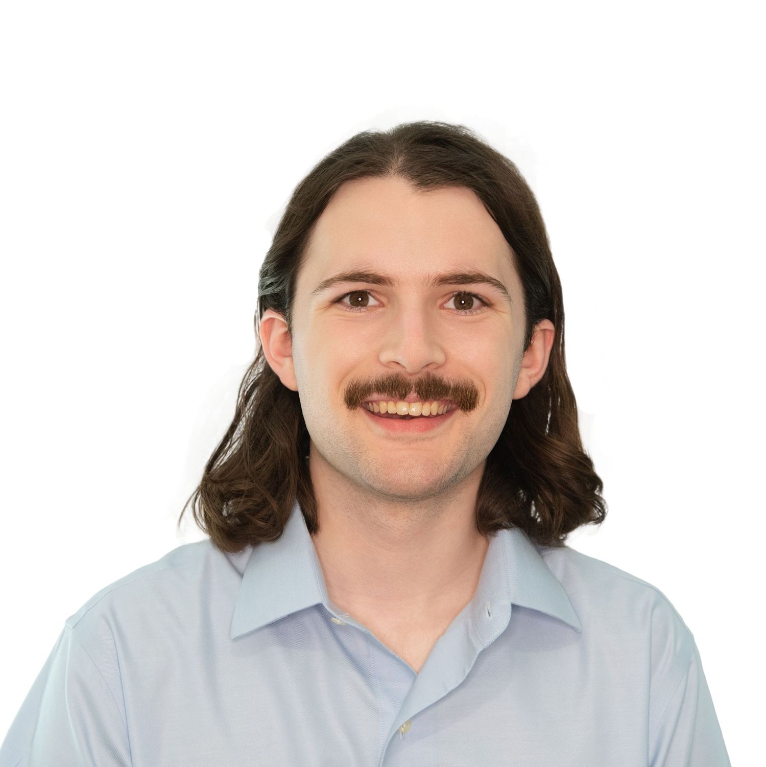 Headshots of a person with shoulder-length brown hair and a mustache photographed by Leah Ramuglia Photography in Boston, MA.